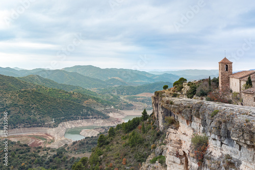 Stone church of Siurana on cliff and marsh.