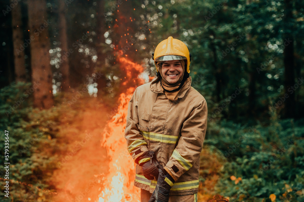 Firefighter at job. Firefighter in dangerous forest areas surrounded by strong fire. Concept of the work of the fire service Firefighter at job. Firefighter in dangerous forest areas surrounded by strong fire. Concept of the work of the fire service