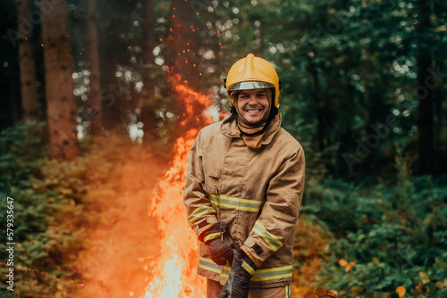 Firefighter at job. Firefighter in dangerous forest areas surrounded by strong fire. Concept of the work of the fire service