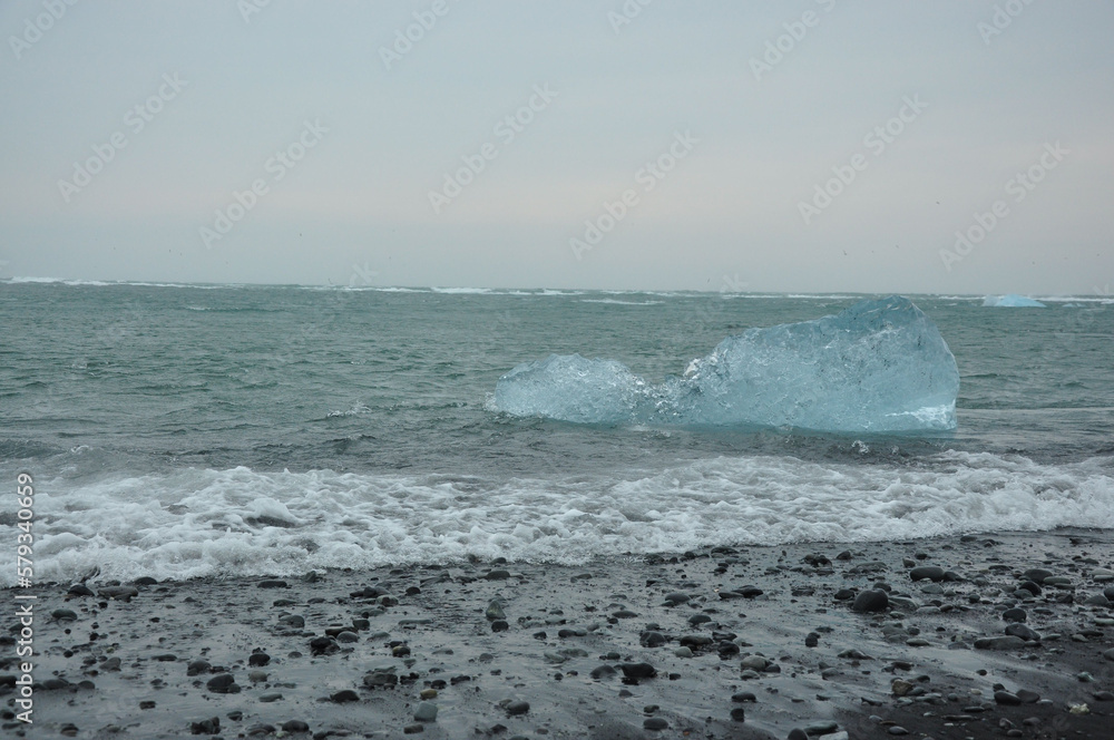 Crystal clear ice chunks near the black sand of Diamond beach in Fellsfjara, Jokulsarlon on Iceland Crystal clear ice chunks near the black sand of Diamond beach in Fellsfjara, Jokulsarlon on Iceland