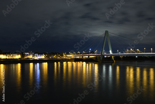 Severinsbrucke and the Rhine at night in Cologne, Germany