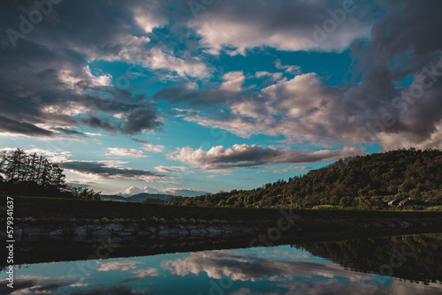 Fototapeta Naklejka Na Ścianę i Meble -  Mirror-like sky and clouds at the fishing spot