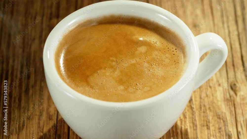 Super slow motion of falling drop into coffee with camera motion. Filmed on high speed cinema camera, 1000fps placed on high speed cine bot. Super slow motion of falling drop into coffee with camera motion. Filmed on high speed cinema camera, 1000fps placed on high speed cine bot.
