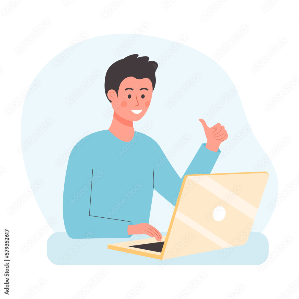 Young man sitting at the desk and using laptop. Office worker showing thumbs up. Young man sitting at the desk and using laptop. Office worker showing thumbs up.