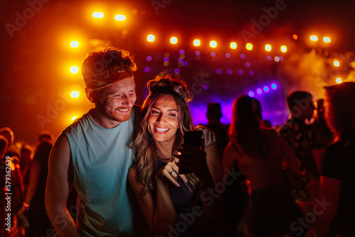 Couple takes selfie at concert