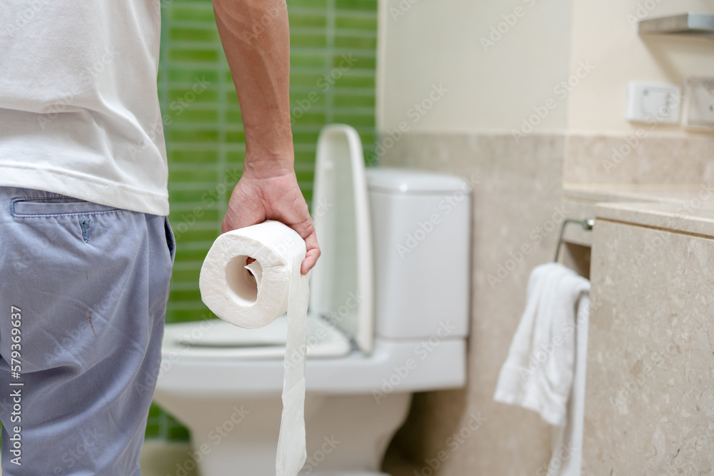 Constipation and diarrhea in bathroom. Hurt man touch belly stomach