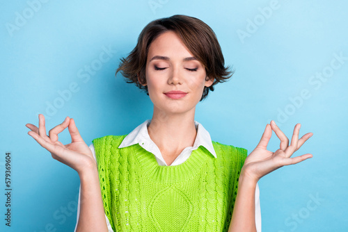 Canvas Print Photo of young relaxed lady wear green knit wear bob brown hair fingers balance