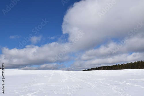 A snowy field under a winter sky, Québec, Canada © Claude Laprise