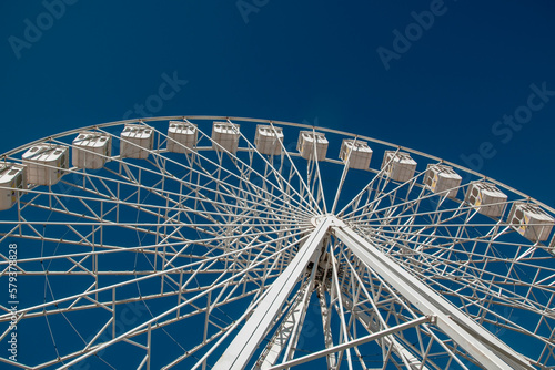 Ferris Wheel over blue sky, Lisbon, Portugal