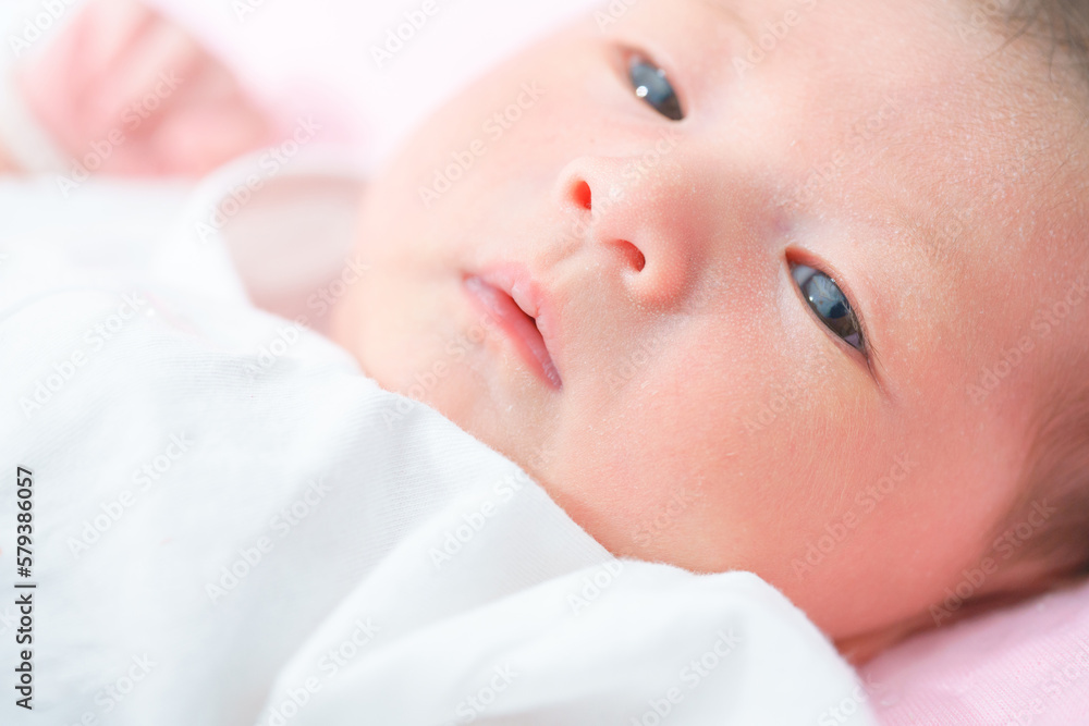 Portrait of a newborn Asian baby girl sleep on the bed , cute Fat baby 5 day. Portrait of a newborn Asian baby girl sleep on the bed , cute Fat baby 5 day.