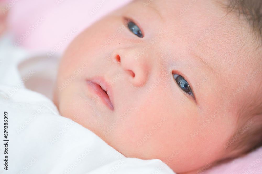 Portrait of a newborn Asian baby girl sleep on the bed , cute Fat baby 5 day. Portrait of a newborn Asian baby girl sleep on the bed , cute Fat baby 5 day.