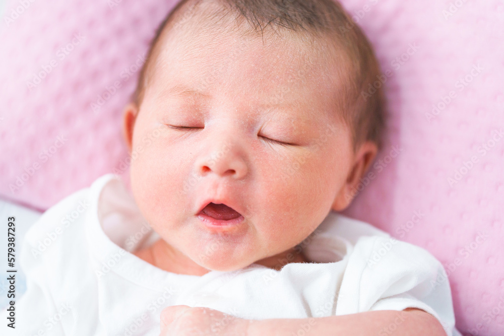Portrait of a newborn Asian baby girl sleep on the bed , cute Fat baby 5 day. Portrait of a newborn Asian baby girl sleep on the bed , cute Fat baby 5 day.