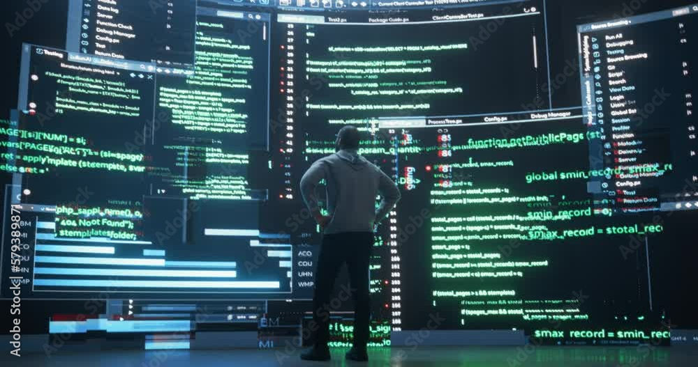 Back View of Young Black Man Walking and Looking at Big Digital Screens ...