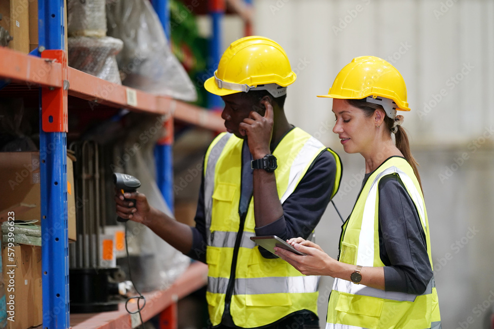 Worker Doing Inventory in Warehouse. Dispatcher in uniform making inventory in storehouse. supply chain concept Worker Doing Inventory in Warehouse. Dispatcher in uniform making inventory in storehouse. supply chain concept