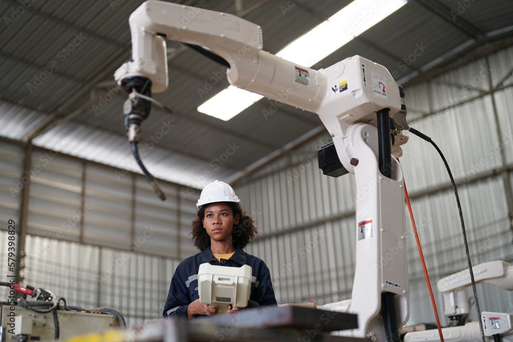 Female Industrial factory employee working in metal manufacturing industry