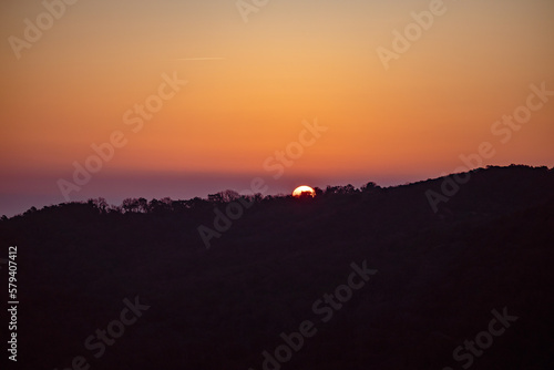 Sunrise over forest in village of Gassin  France