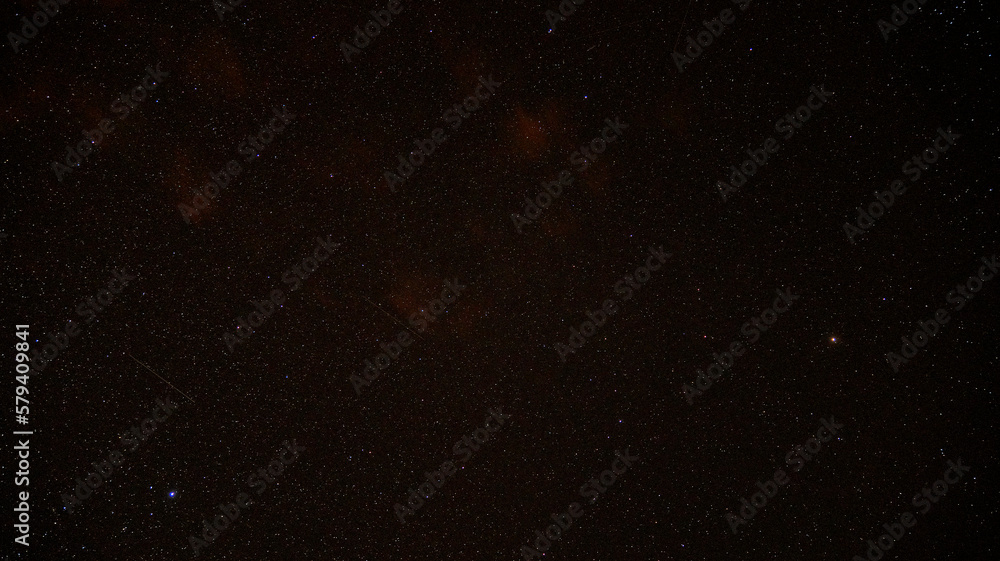 Obraz premium Stars and small shooting star in night sky