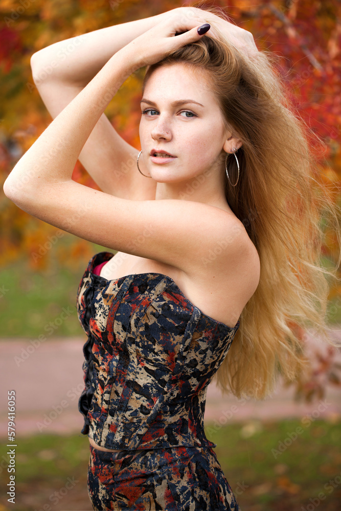Portrait of beautiful young woman in dress