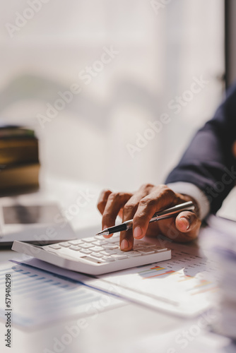 Portrait of man working on tablet computer in modern office make account analysis report Real estate investment information, financial and tax system concept