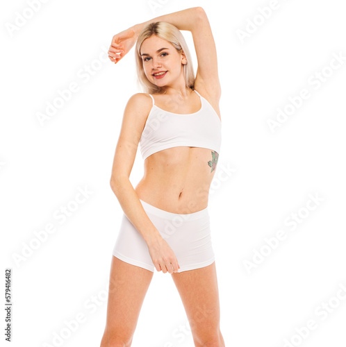 Young beautiful blonde woman in white sports underwear