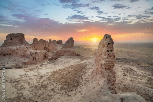 Ruins of ancient Khorezm fortress Ayaz Kala in Kyzylkum desert on sunrise, Uzbekistan photo