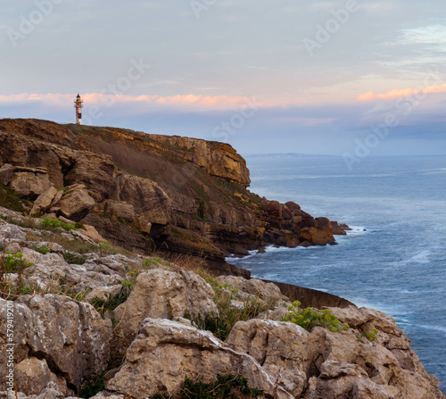 Faro de Ajo en Cantabria a orillas del mar Cantábrico al amanecer