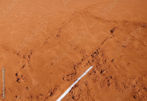 Tennis court in clay, with lines and dirt. Generating with AI