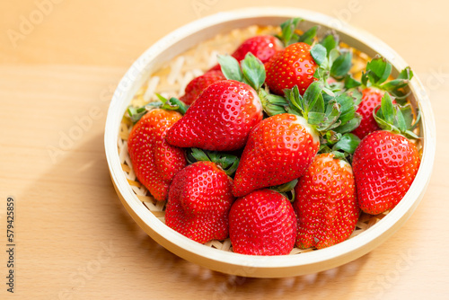 Fresh strawberries arranged on a basket