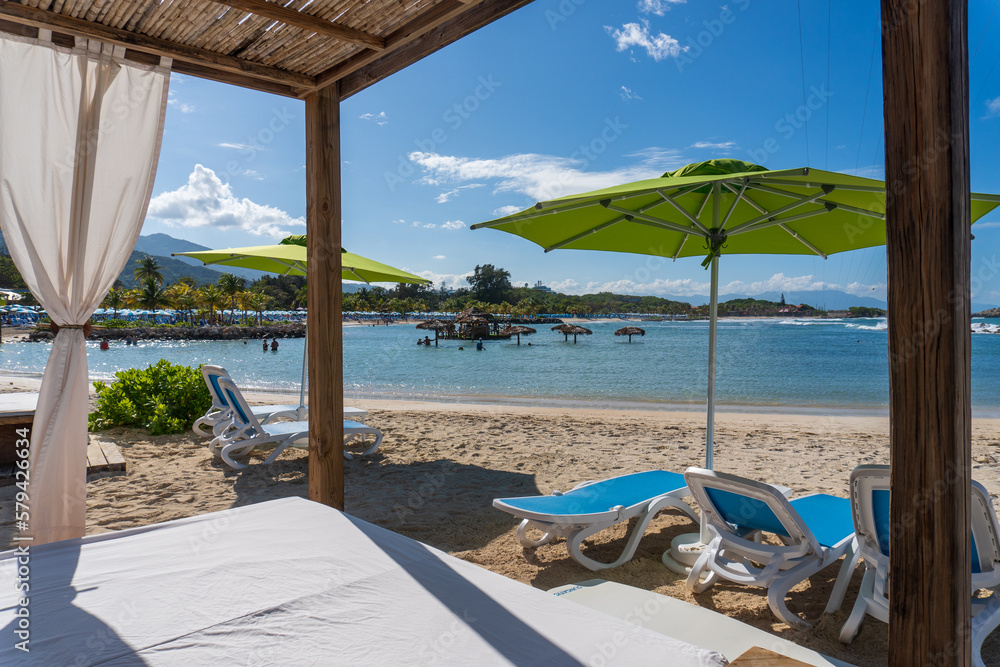 Beach cabanas overlooking the Caribbean Sea. Relax in the shade. Beach