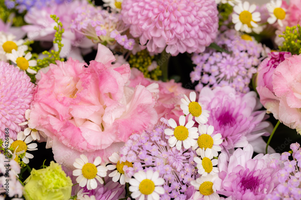 Fototapeta premium Purple flower arrangement in a box