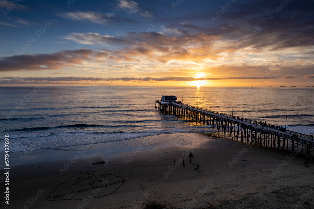 Fototapeta premium Drone shot of a metallic pier of the sea at sunset, cool for background
