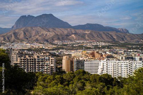 Benidorm tourist town. apartment buildings, hotels on La Cala de Finestrat. Panorama of the densely built-up city with mountains in the background