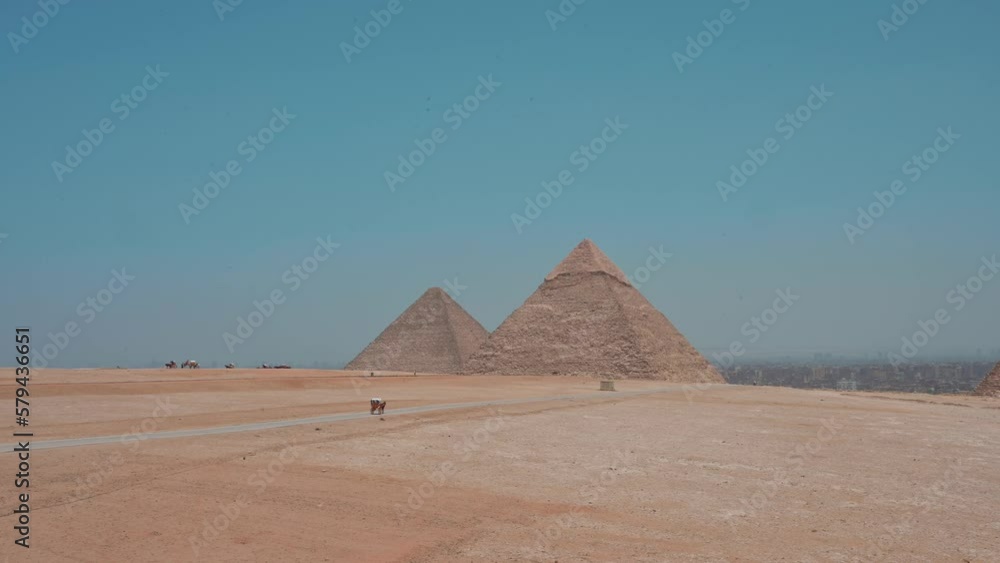 Ancient Egyptian pyramids in Cairo against the blue sky Ancient Egyptian pyramids in Cairo against the blue sky