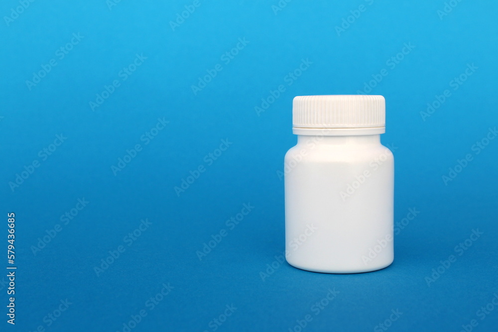 On a blue background is a plastic container. On a blue background is a plastic container.