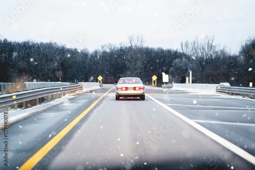 Car driving on the slippery road during winter