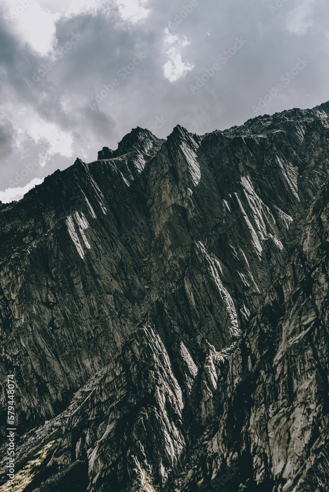 Vertical landscape of the beautiful rocky Gotthard Pass mountain pass in the Alps