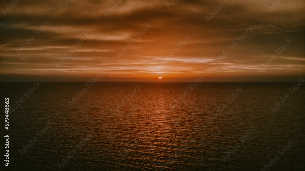 Mesmerizing orange sunset over the horizon of the sea