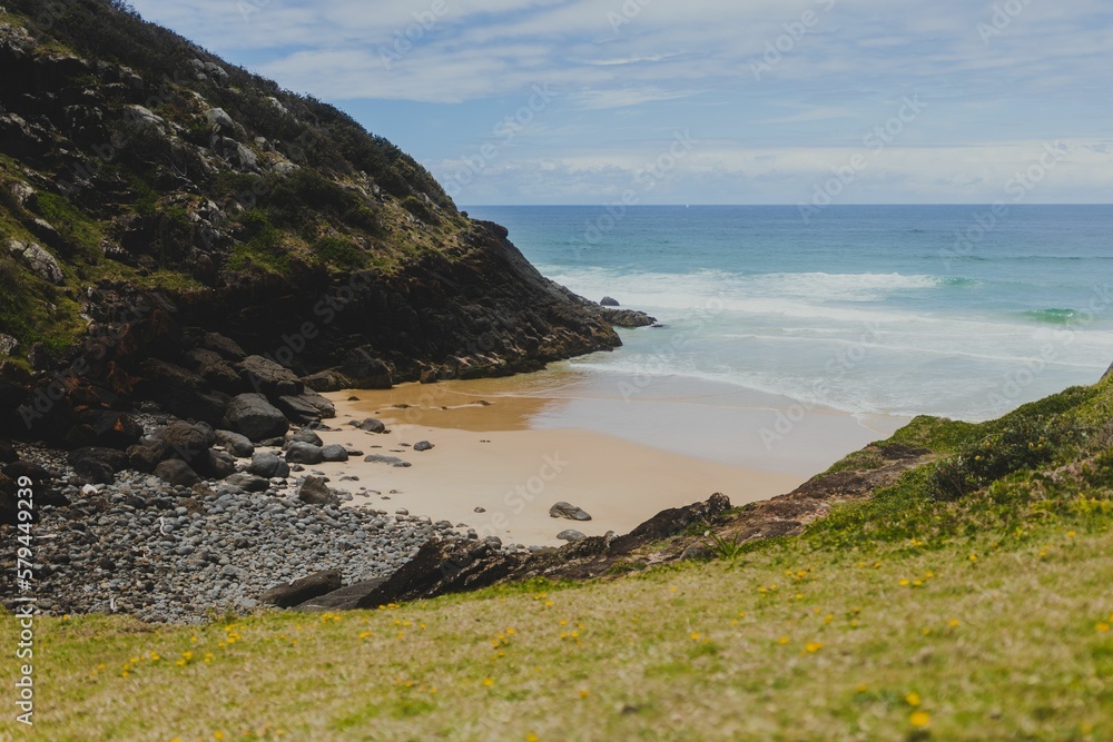 Wide Shot Of A Beautiful Beach With Blue Water Wide Shot Of A Beautiful Beach With Blue Water