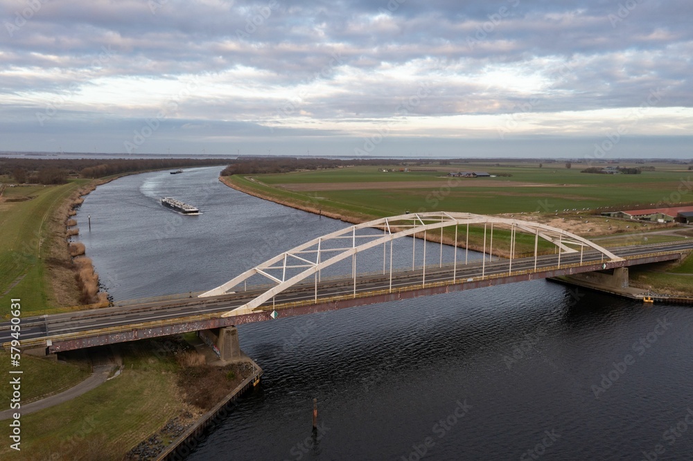 Aerial view of a bridge under a cloudy sky