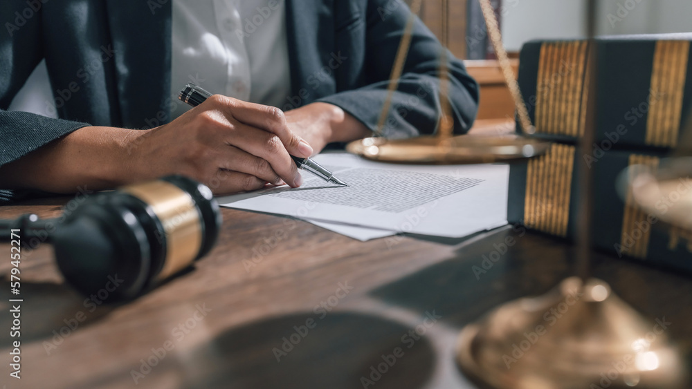 lawyer or judge counselor reading  legal contract documents in office.