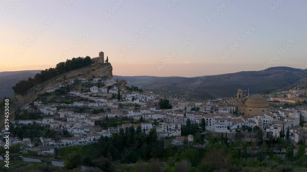 Lovely aerial view of the Montefrio village in the White Towns of Andalusia in Spain at sunset Lovely aerial view of the Montefrio village in the White Towns of Andalusia in Spain at sunset