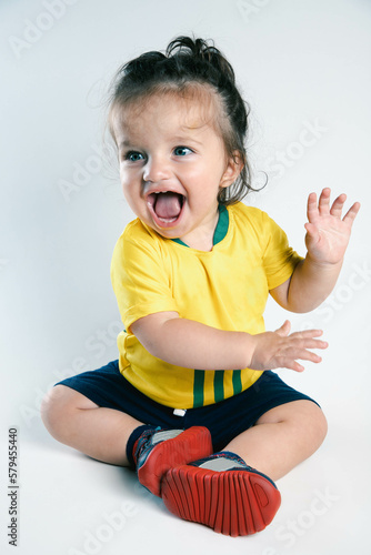 Child with the shirt of the Brazilian soccer team