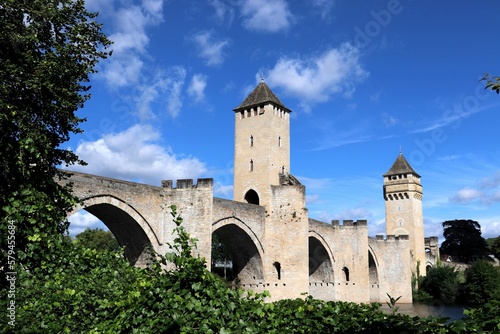 an old castle that is by a river in the distance