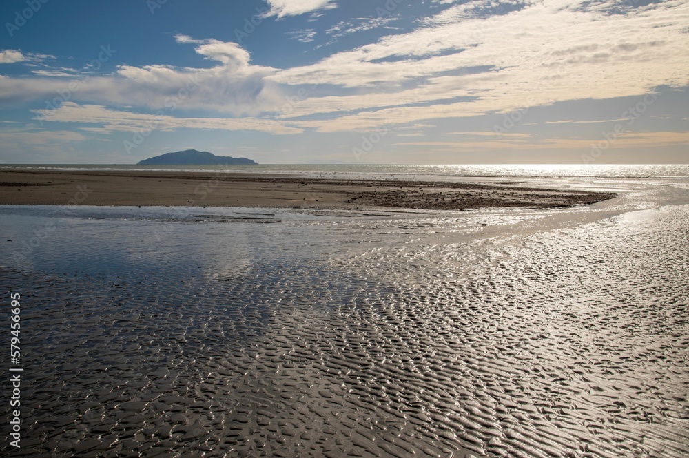 Waitohu stream and the Tasman sea at Otaki Beach in Kapiti, New Zealand, Kapiti Island in distance Waitohu stream and the Tasman sea at Otaki Beach in Kapiti, New Zealand, Kapiti Island in distance