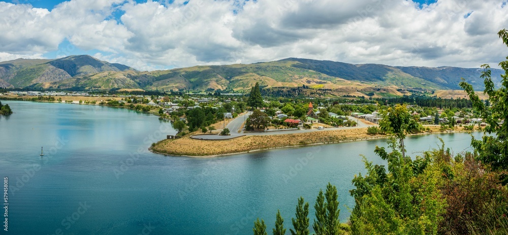 Aerial panoramic view of Lake Dunstan surrounded by lush green vegetation on South Island