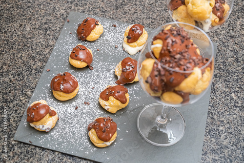 Amazon fruit profiterolis covered in chocolate and cacao nibs photo