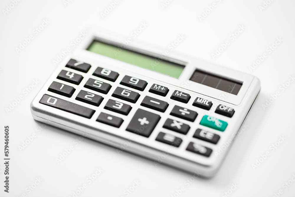 Calculator pocket, financial calculations, solar battery, selective focus Calculator pocket, financial calculations, solar battery, selective focus
