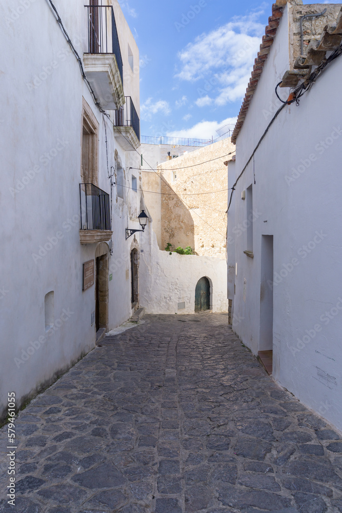 Streets of the old town of Ibiza, with the typical white houses of the island, on a sunny day and without tourists