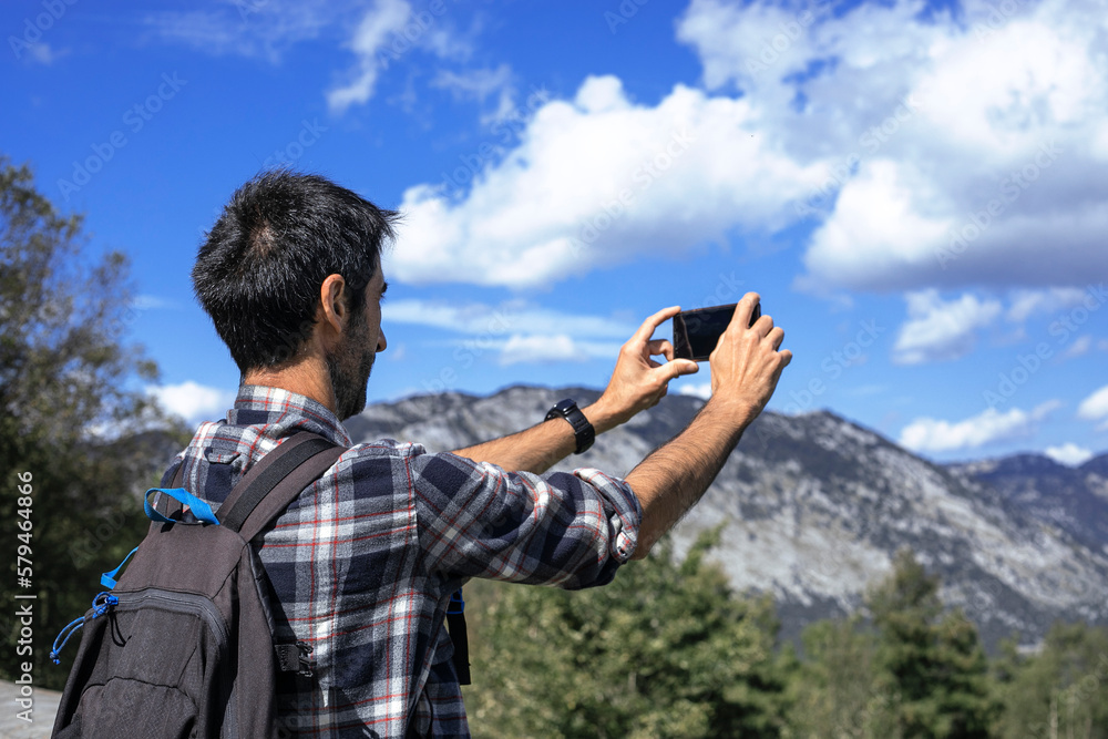 custom made wallpaper toronto digitalHiker takes a photo with his mobile phone.