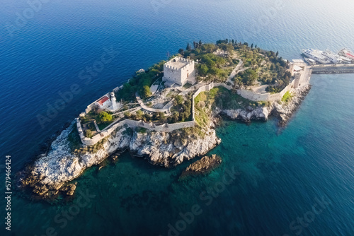 Fototapeta Naklejka Na Ścianę i Meble -  Aerial view of Guvercinada Island with scenic castle at sunrise light, Kusadasi in Turkey